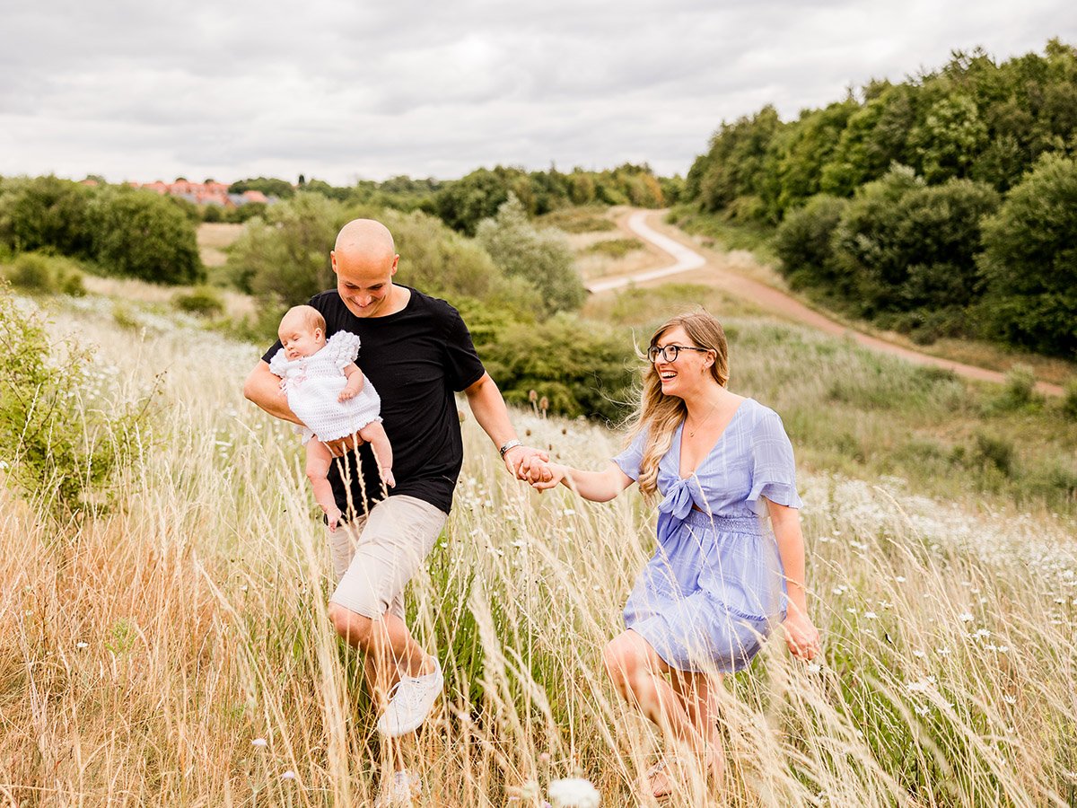 Family walking through grass